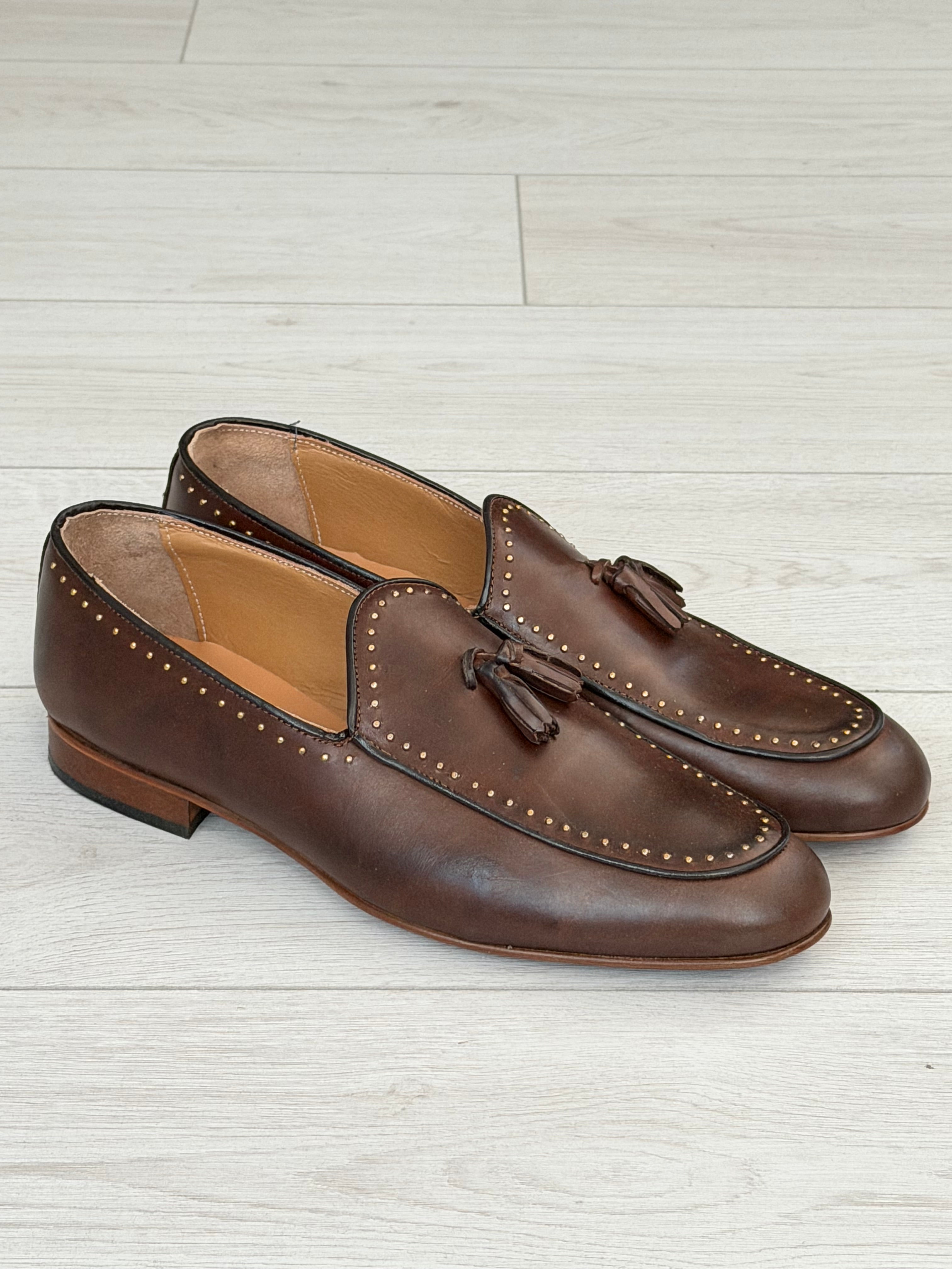 STUDDED LEATHER LOAFERS WITH TASSELS